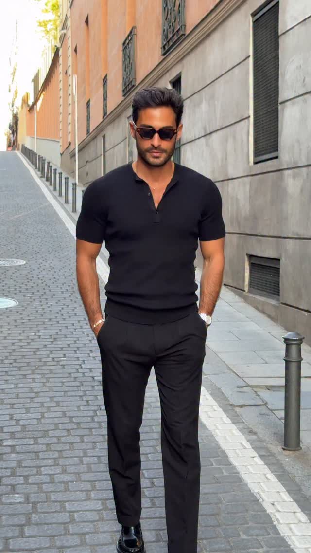 casual black polo shirt — short sleeve, spread collar, three-button placket