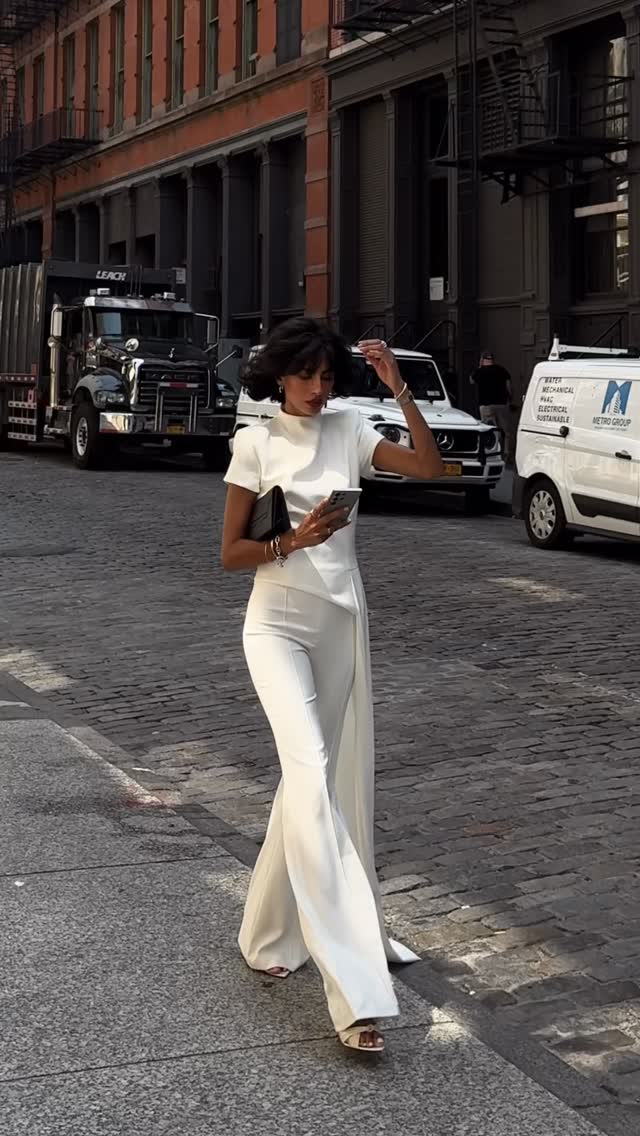minimalist off-white jumpsuit — mock neck, short sleeves, asymmetrical overlay, wide-leg pants