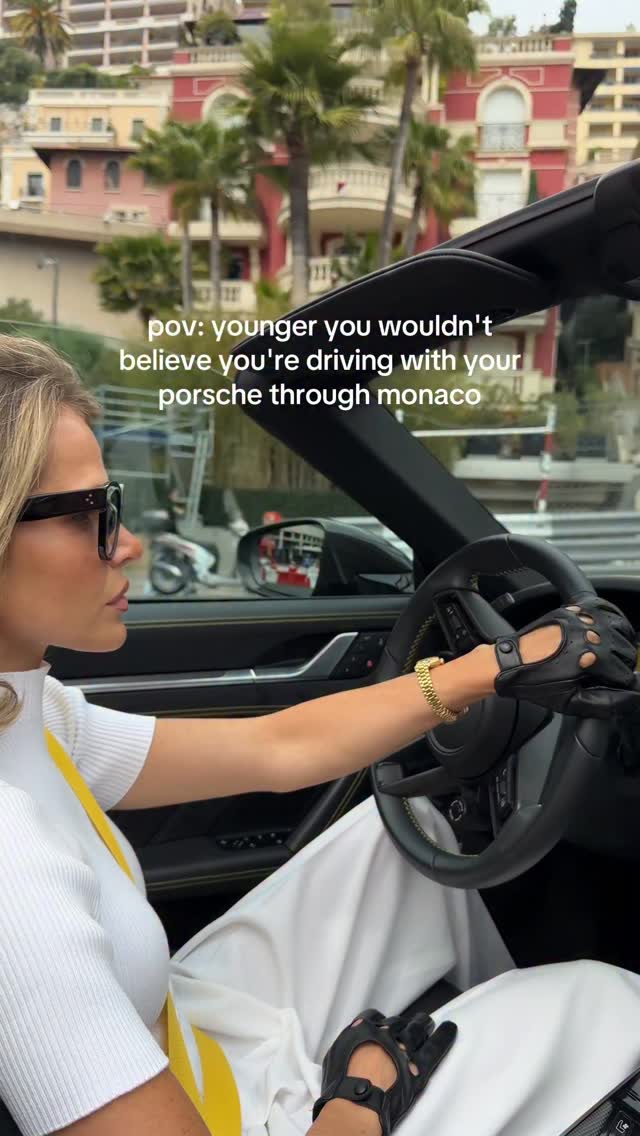 Celine White ribbed top, wide-leg trousers, driving gloves, and sunglasses