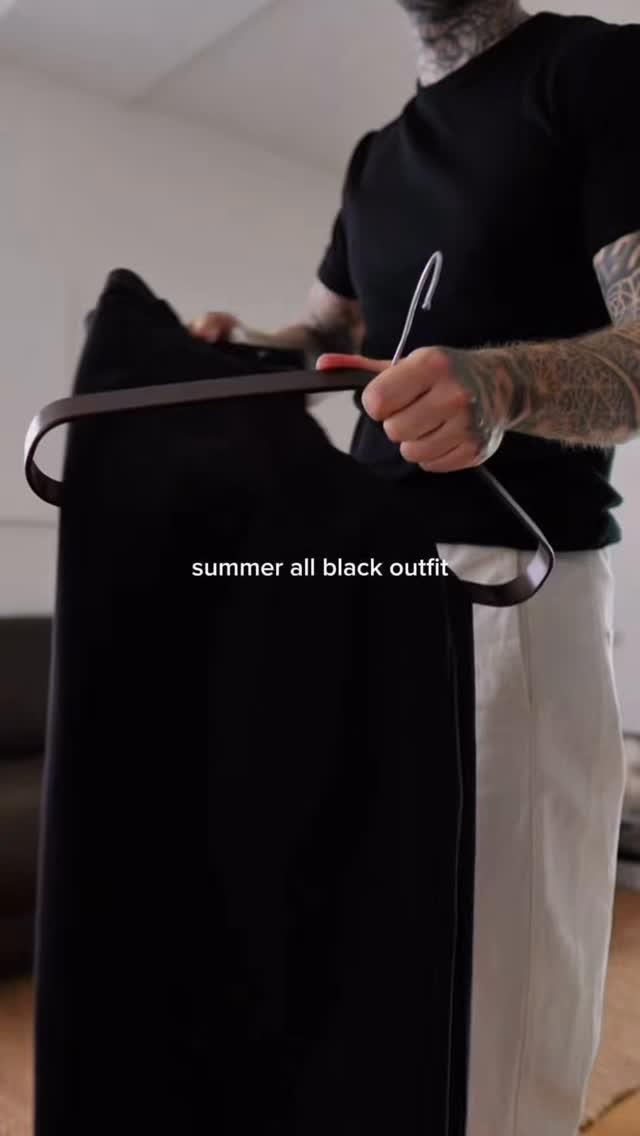 casual black trousers — flat front, no visible pleats