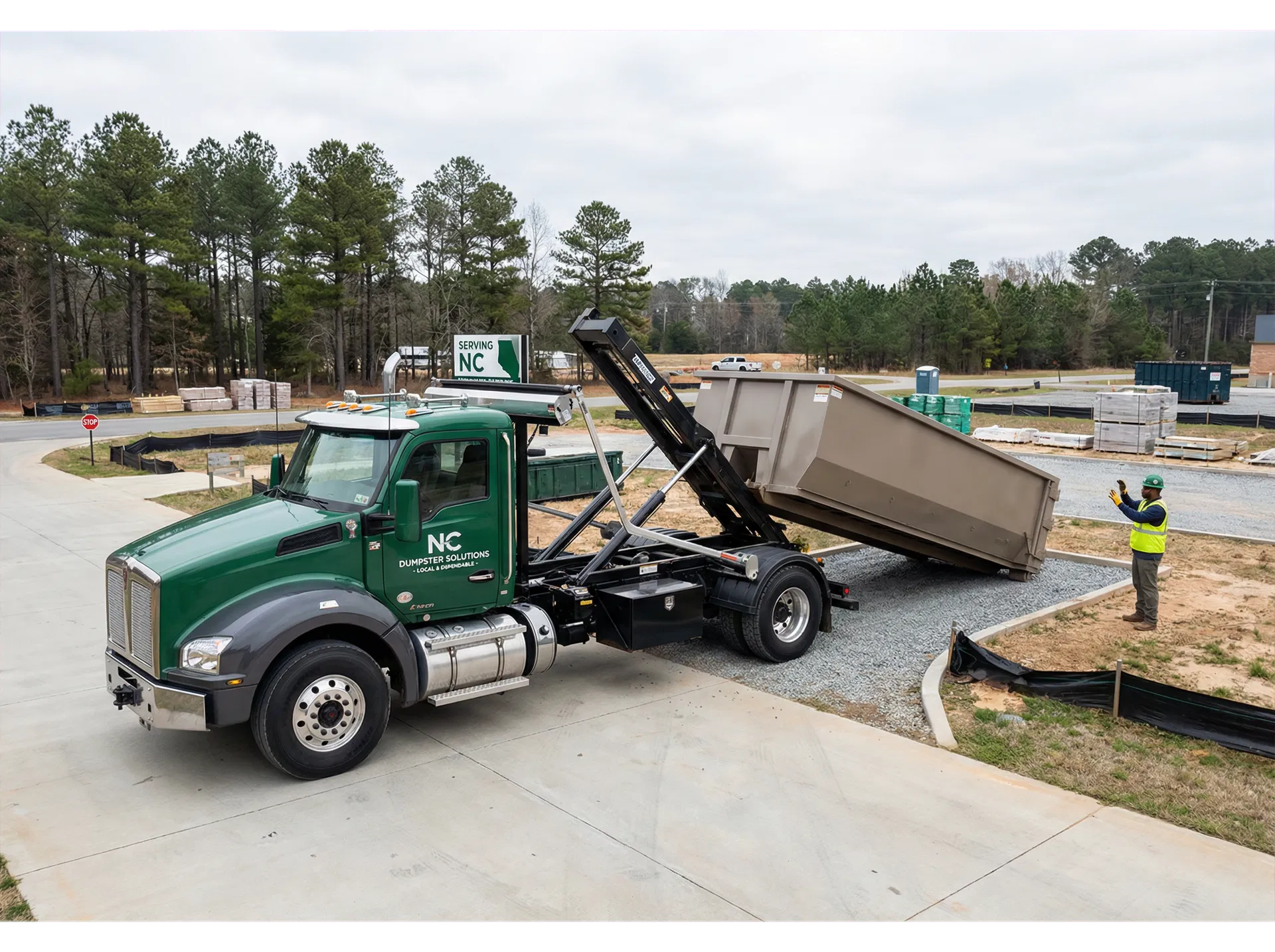Dumpster delivery truck serving a North Carolina job site