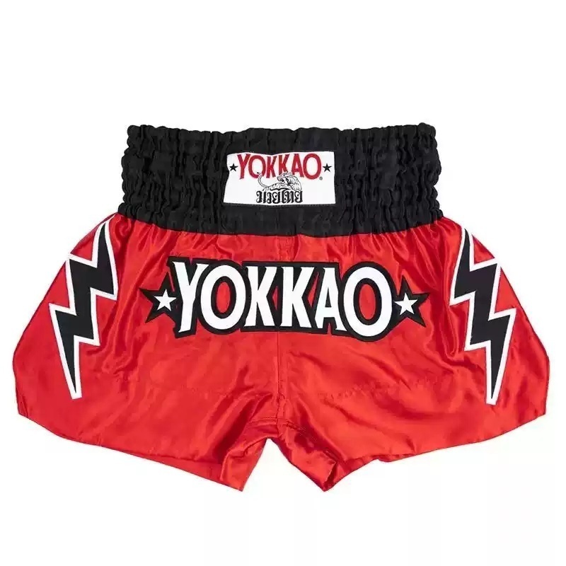 Front close-up of red lightning logo Muay Thai shorts, crafted with premium satin and high-elastic waistband design