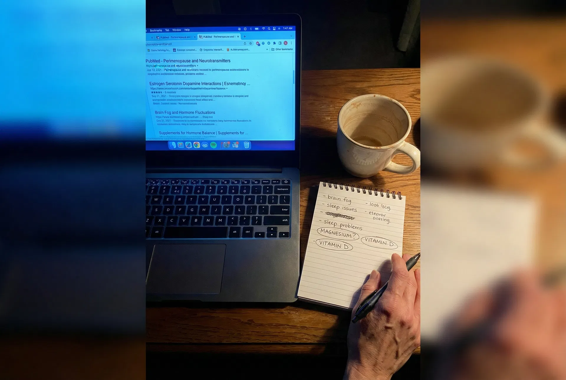 Laptop showing research tabs open at 1:47am with handwritten notes