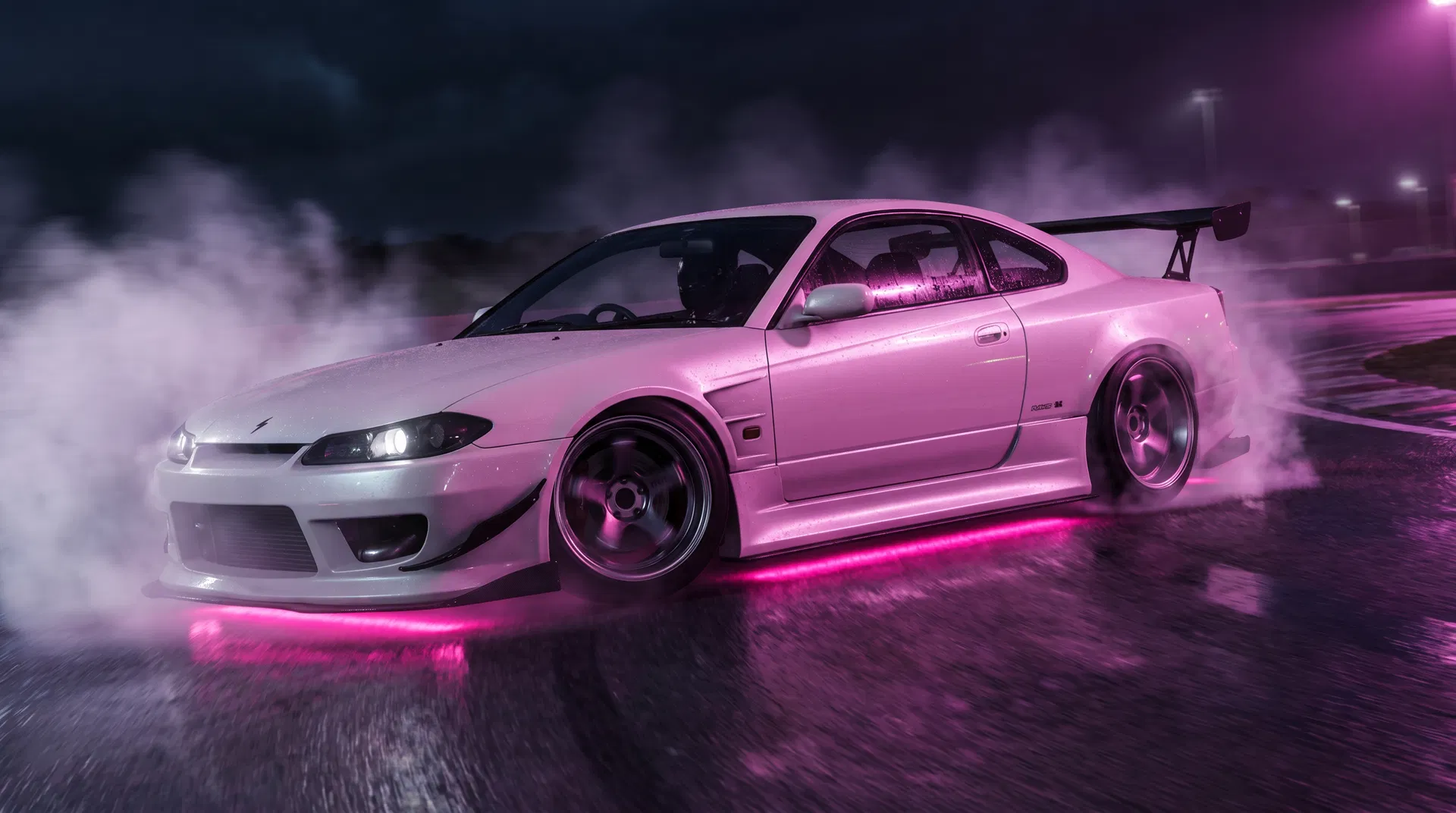 White Nissan Silvia S15 drifting with pink underglow