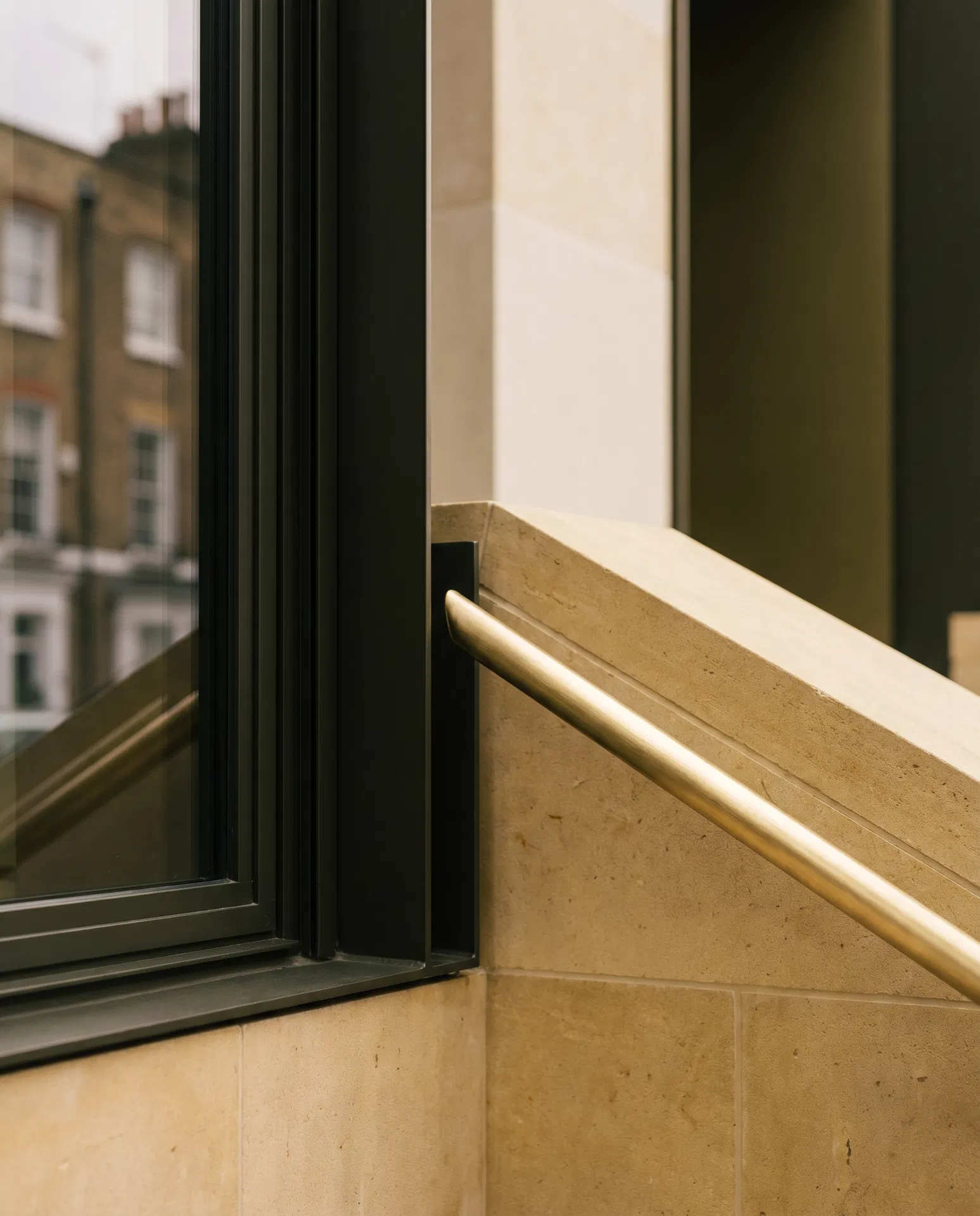 Warm stone and brass architectural detail