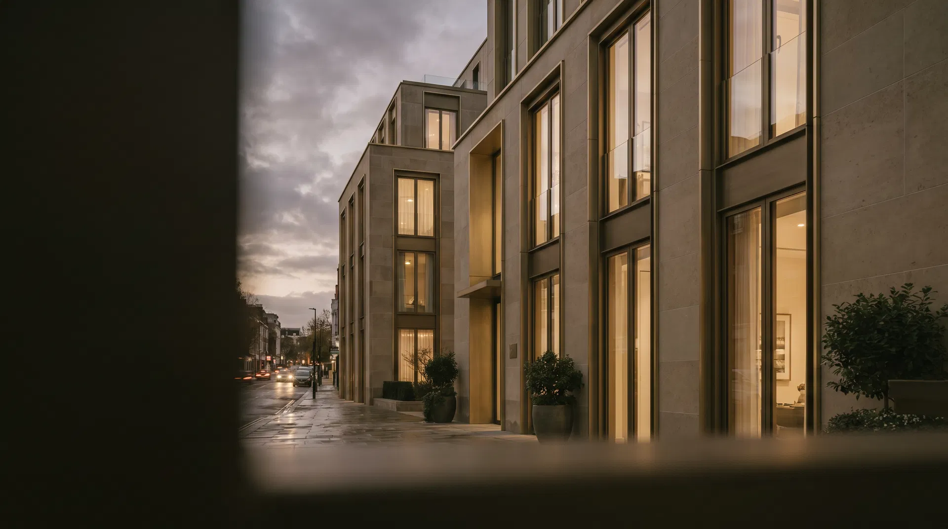 Elegant contemporary residential building with warm stone facade