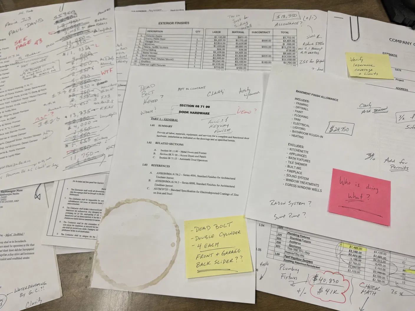 Messy contractor bid with handwritten notes and crossed-out numbers
