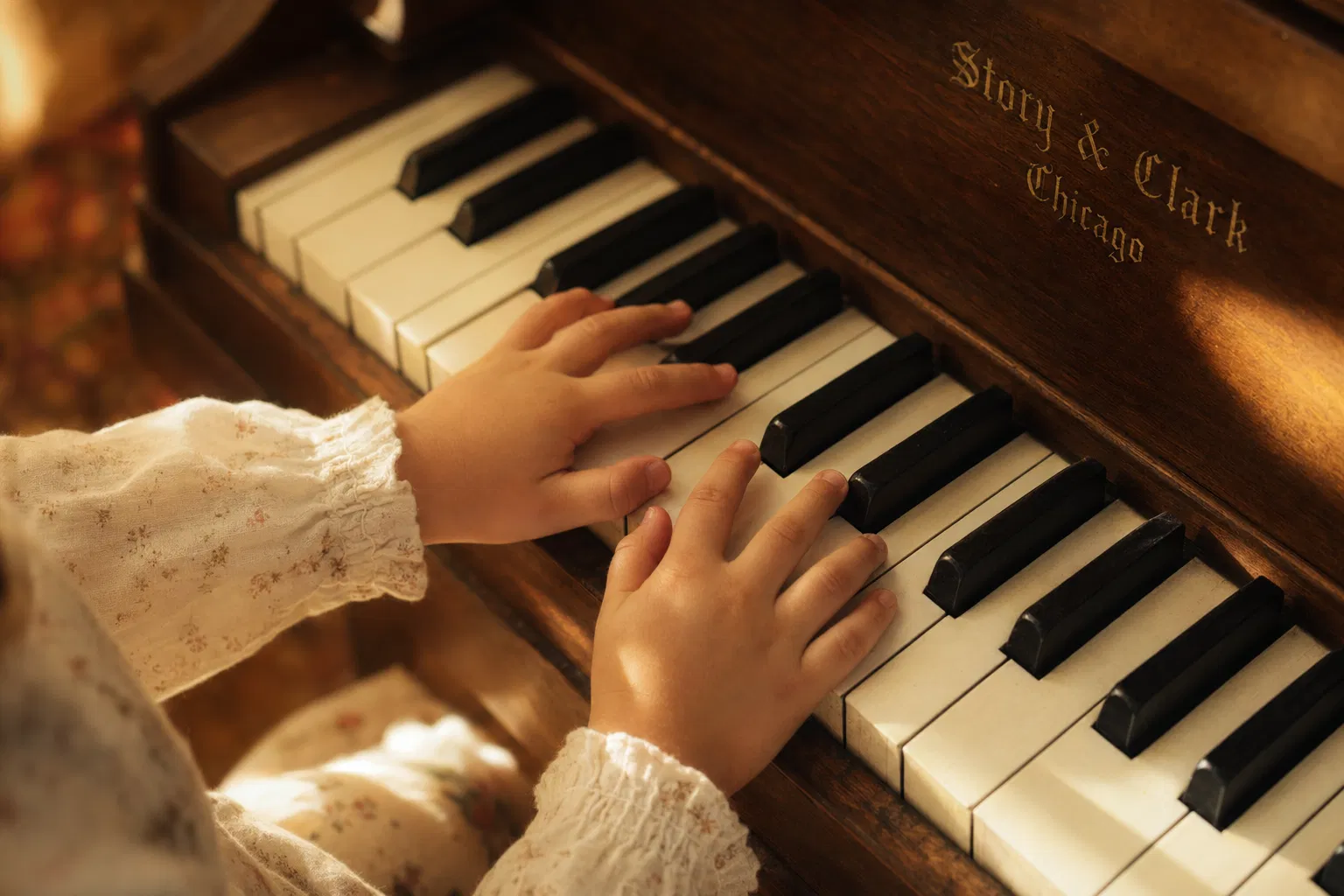 Child's hands on piano keys
