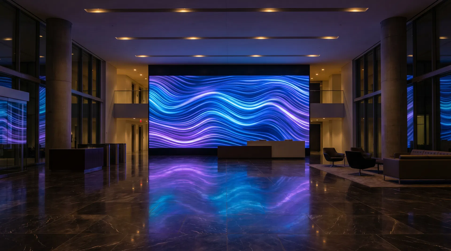 Massive LED video wall in a corporate lobby displaying vivid blue abstract content