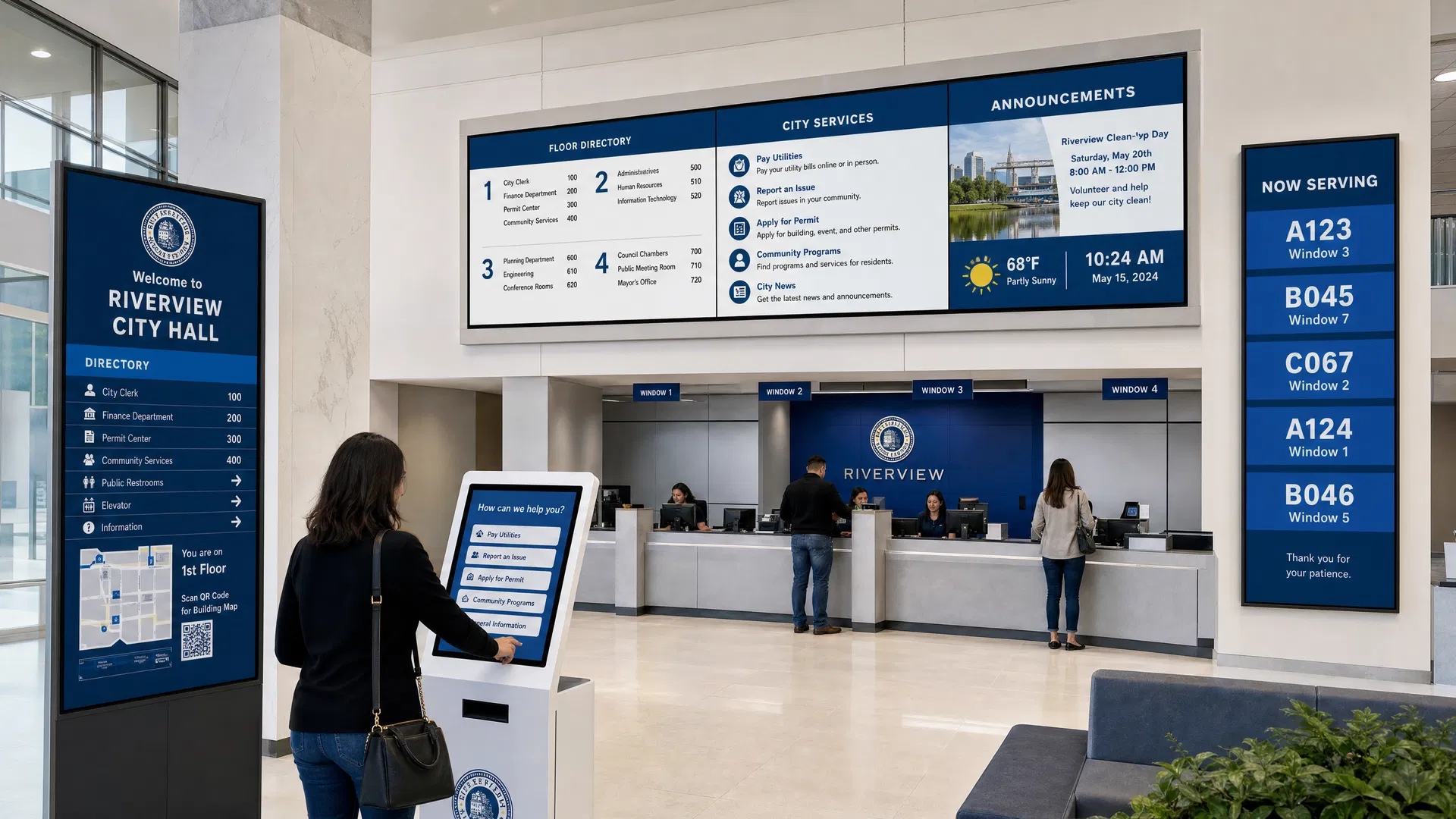 Digital wayfinding and public information displays in a government building lobby with citizens navigating