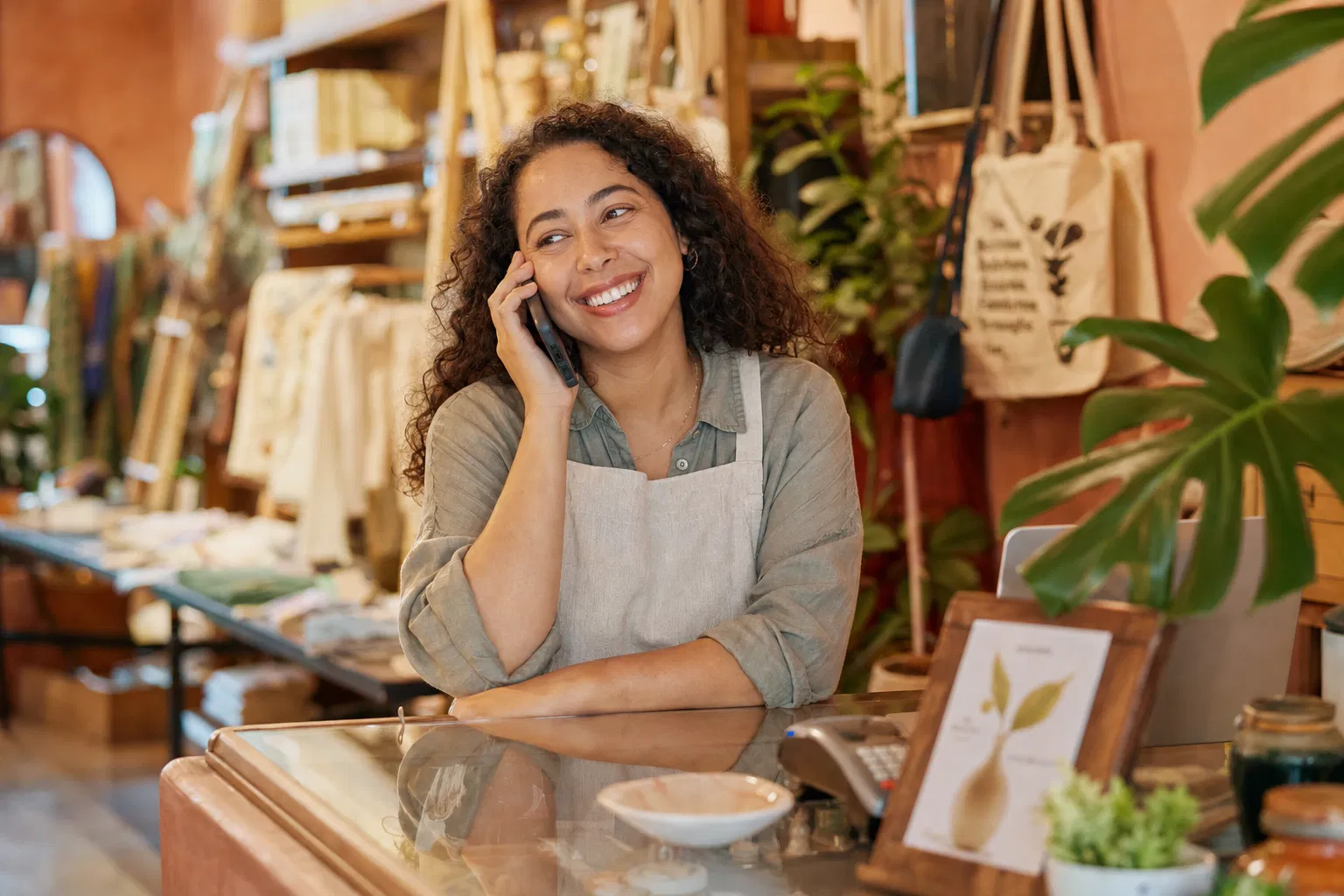 Happy small business owner using AI receptionist