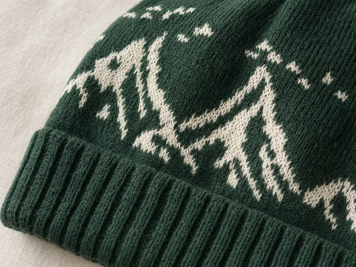 Jacquard knit pattern on forest green beanie