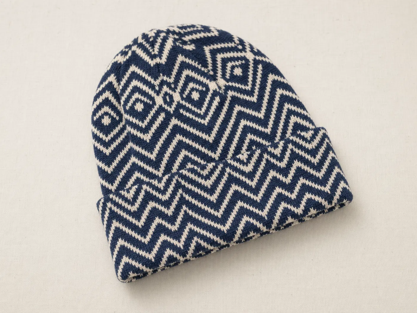 Navy and cream all-over geometric jacquard beanie