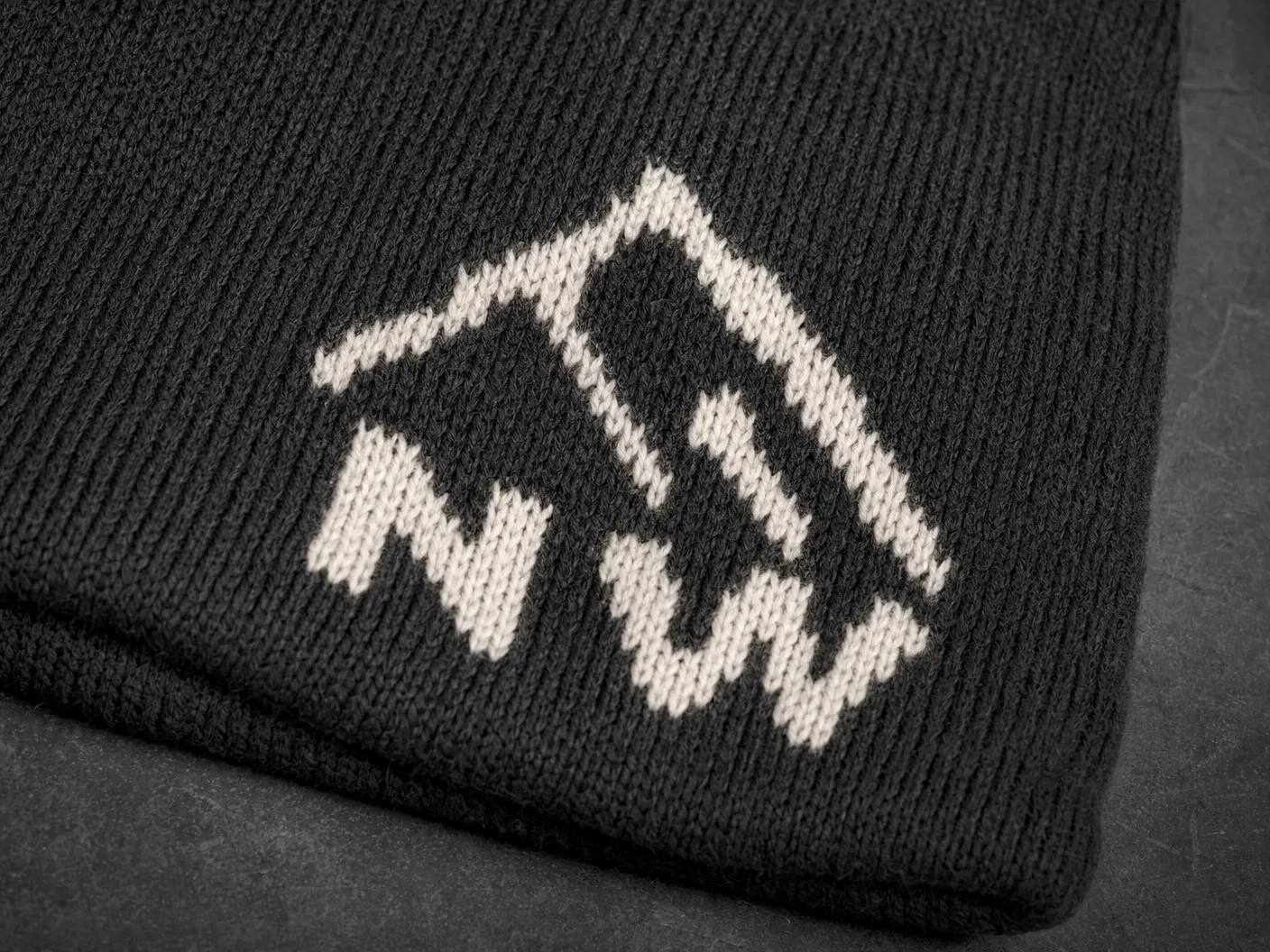 Jacquard knitted mountain logo on charcoal beanie