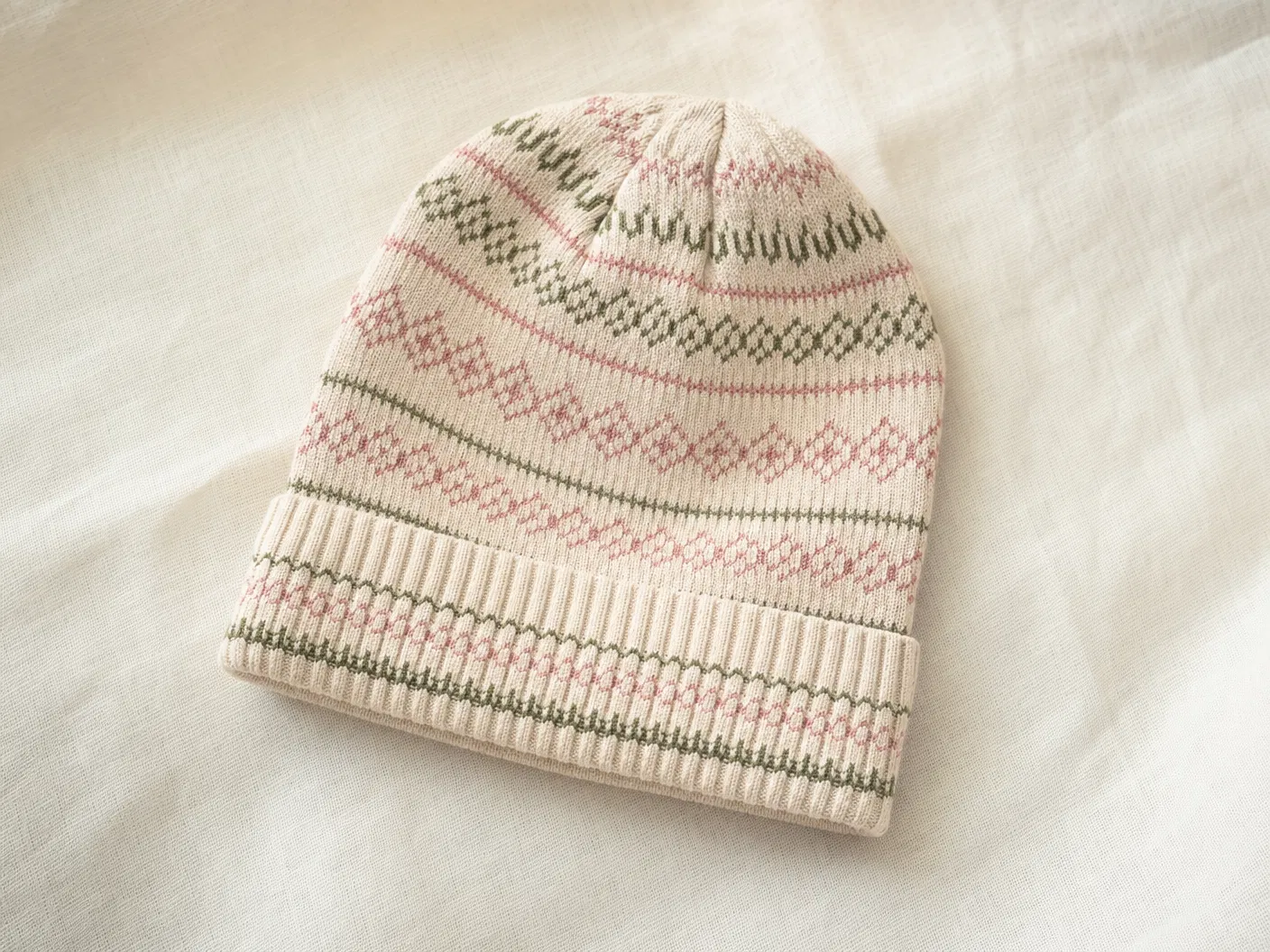 Cream beanie with pink and sage stripe repeat jacquard pattern