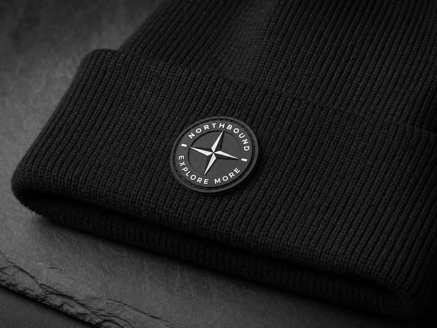 Rubber PVC patch on black beanie