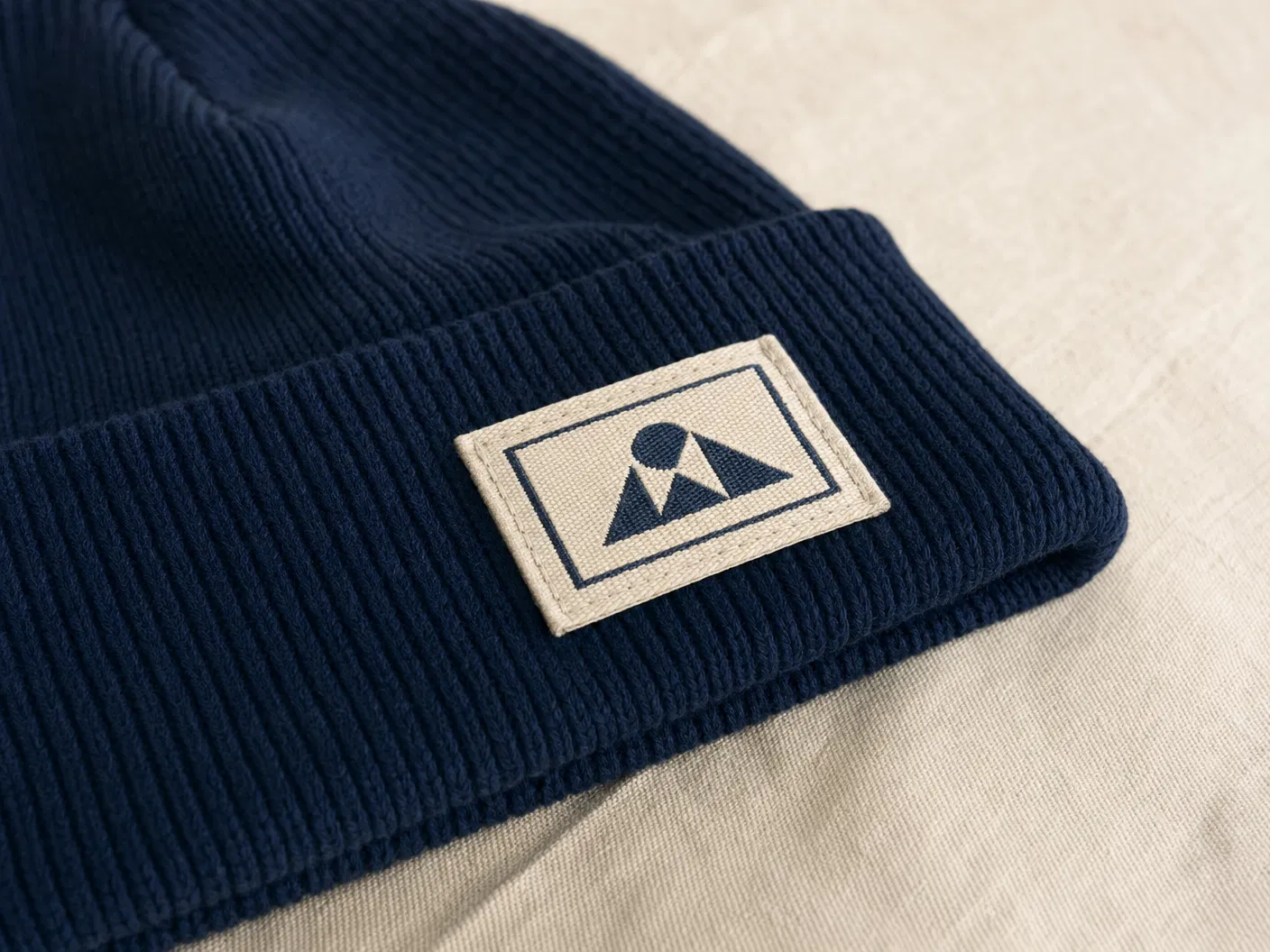 Woven patch on navy knit beanie