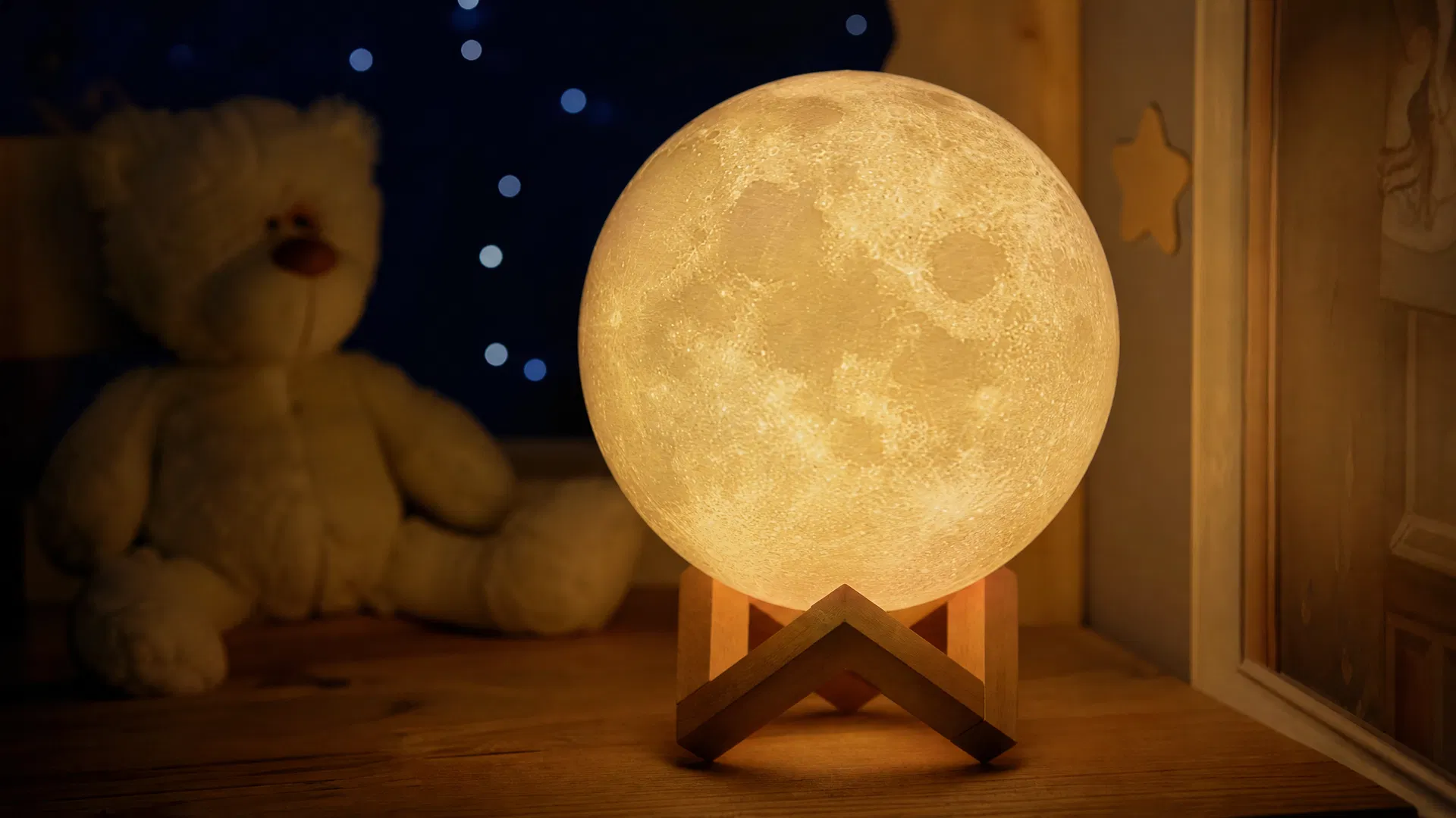 Steven's Halo moon lamp glowing in a nursery