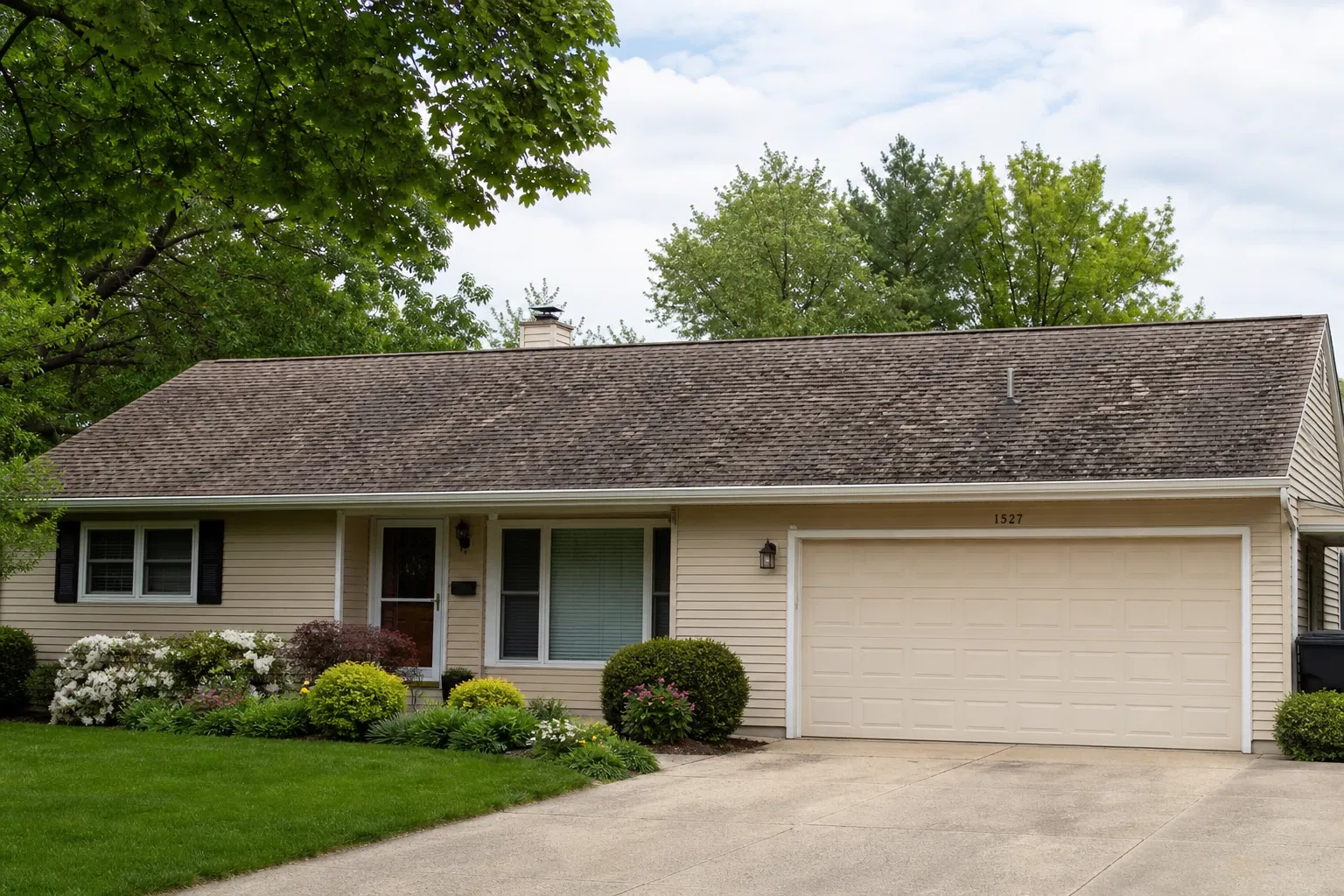 Older home with rusty roof surface before roof replacement planning