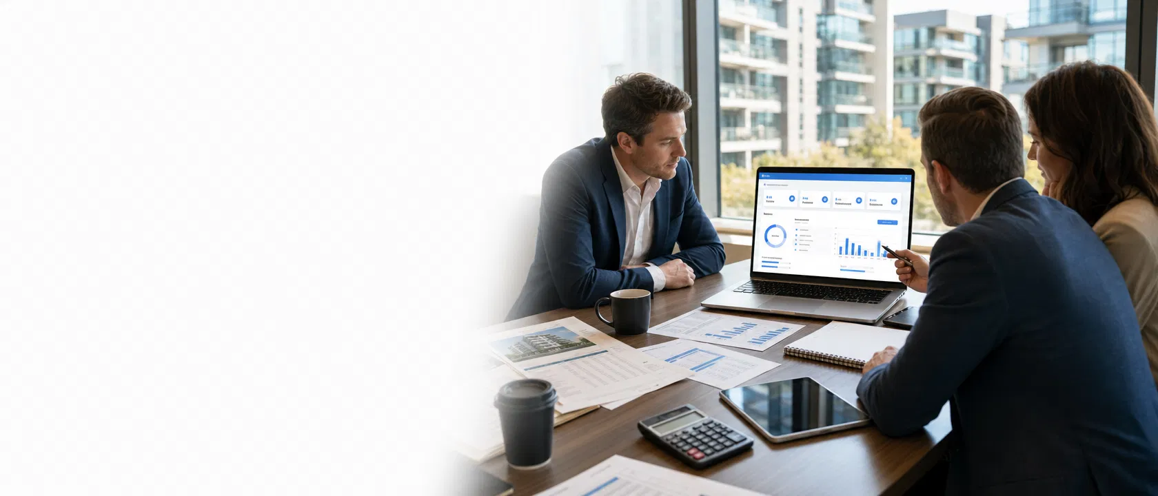 Professional investors reviewing a real estate underwriting dashboard