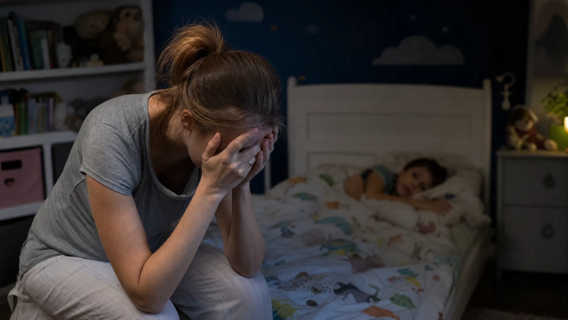 Exhausted parent at bedtime