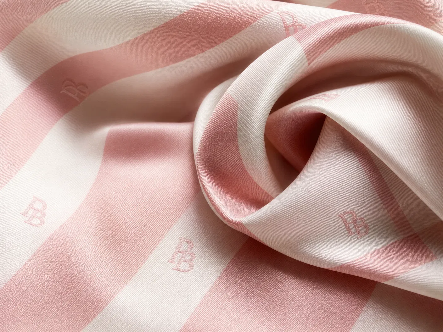 Majesty wearing blush pink silk scarf with gold PB ring