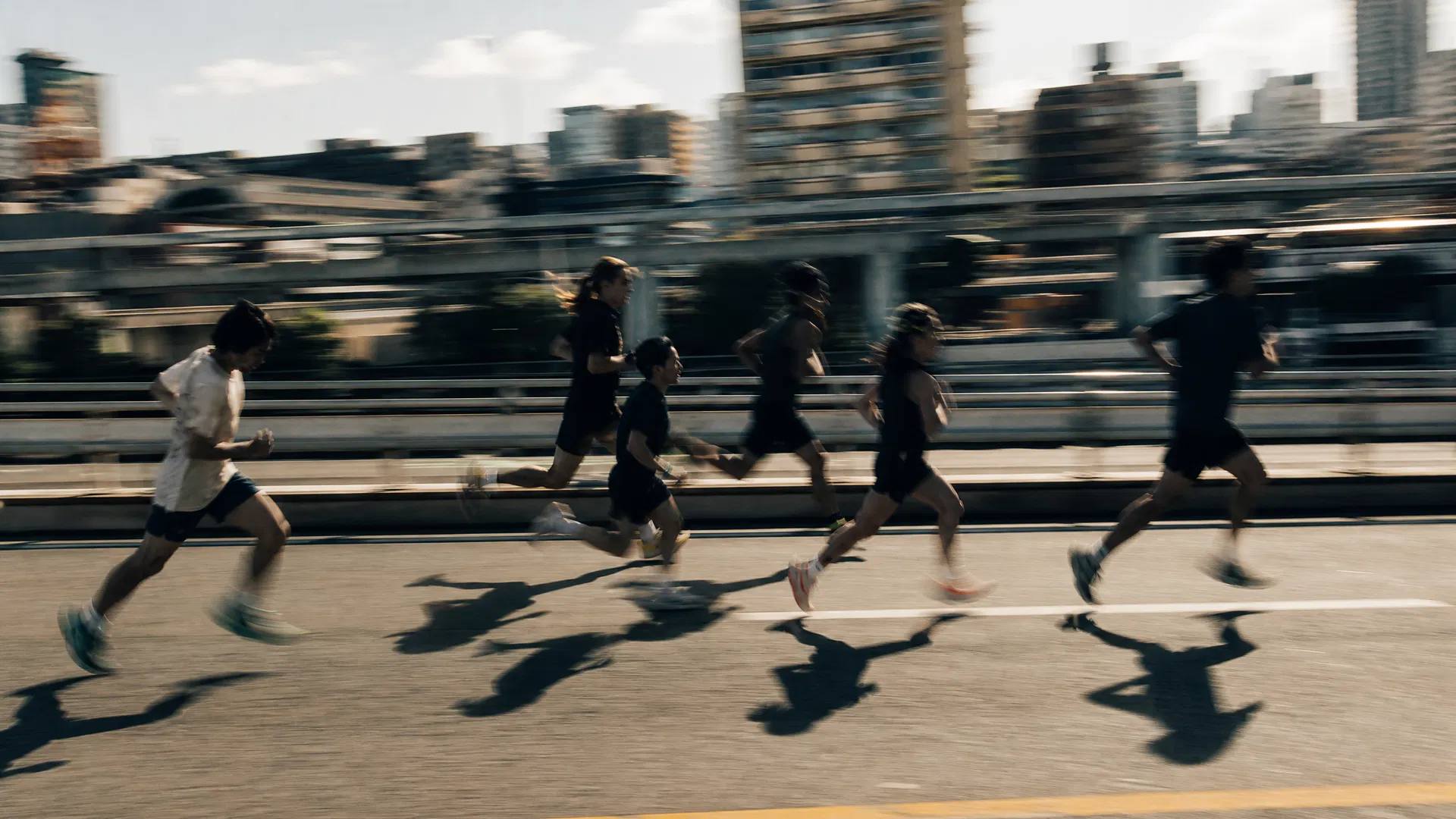 Runners in motion in bright daylight