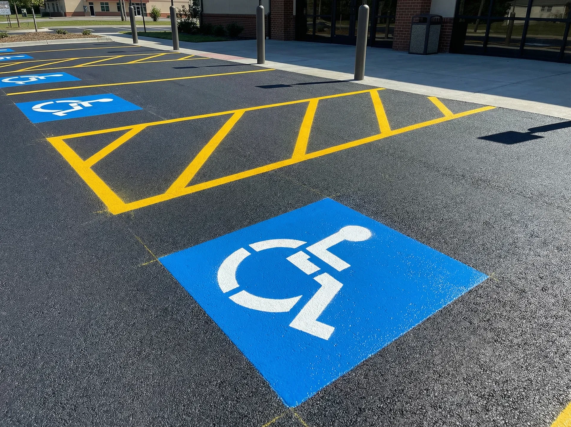 ADA handicap parking striping with blue wheelchair symbols