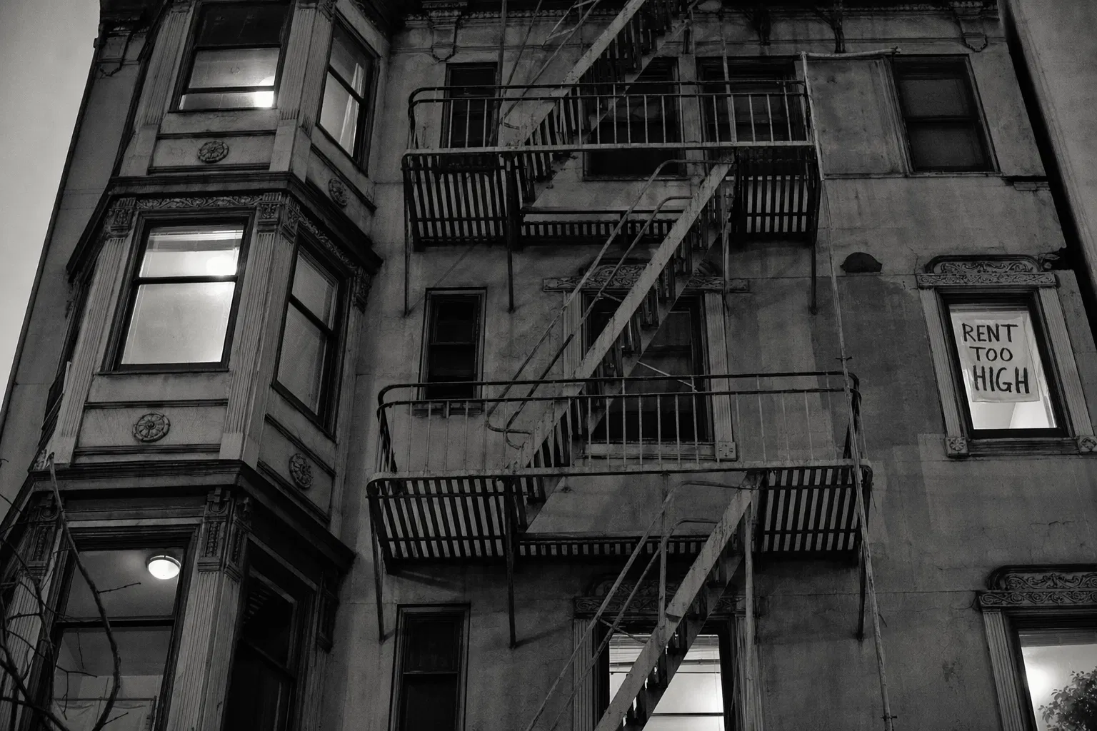 San Francisco apartment building with Rent Too High sign